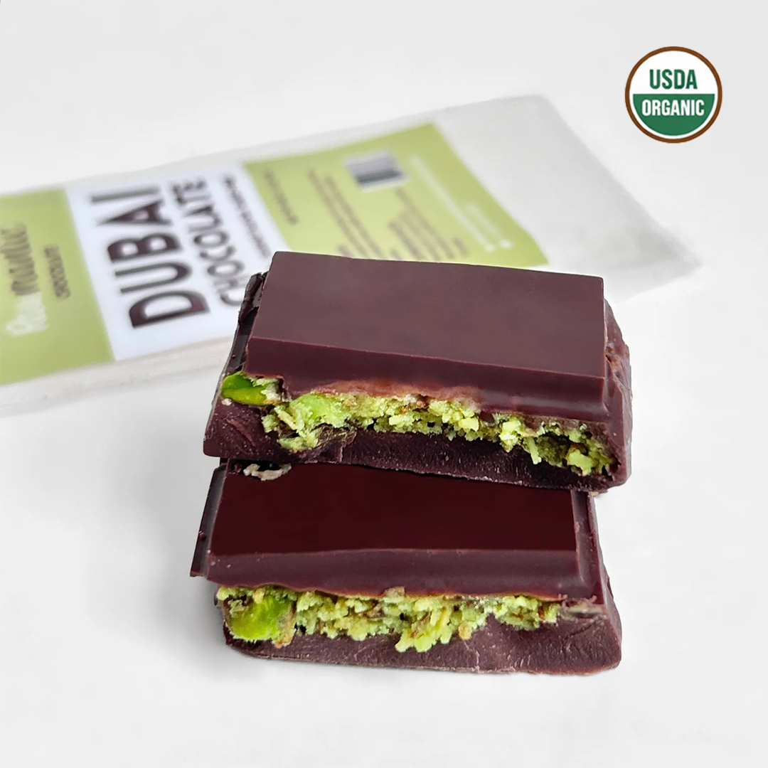 Dubai chocolate pieces stacked to show the crunchy pistachio knafeh center