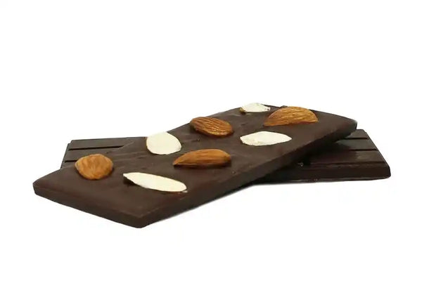 Large almond and dark raw chocolate tablet topped with whole almonds