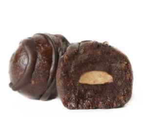 Almond Glow dark chocolate vegan truffle cut open to show the almond center