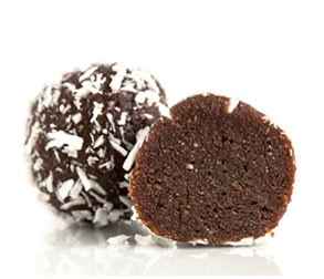 Coconut Energy vegan chocolate truffle cut in half with coconut flake coating