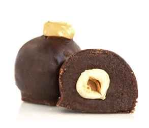 Hazelnut Bliss vegan chocolate truffle cut in half showing a whole hazelnut center