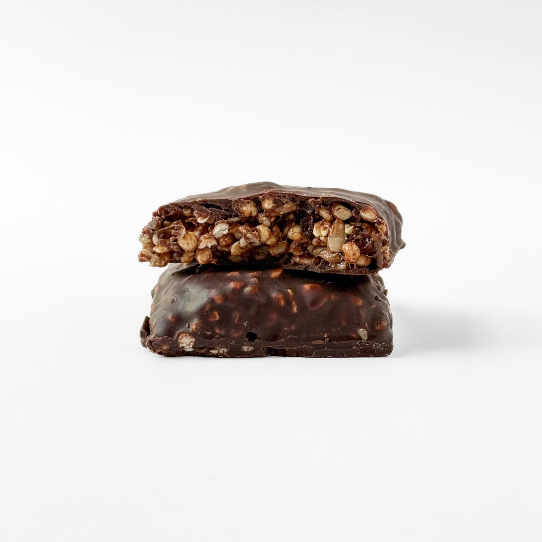 Carob mini protein bar cut in half showing the crunchy center